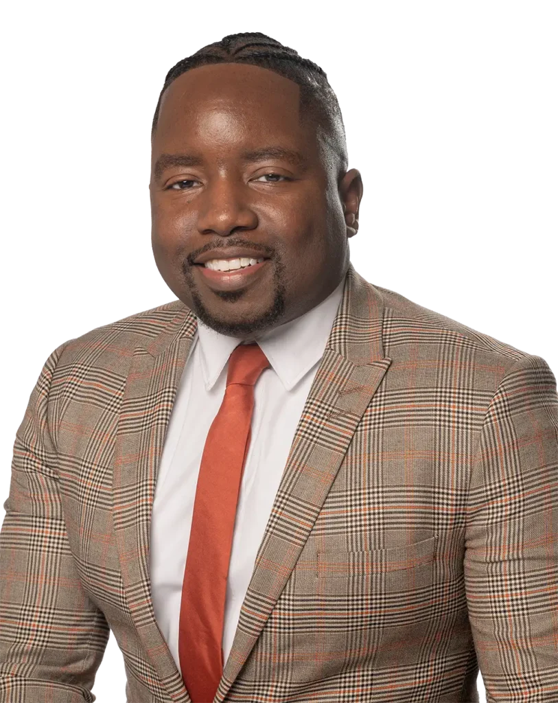 Jimmie Lee in plaid suit and orange tie